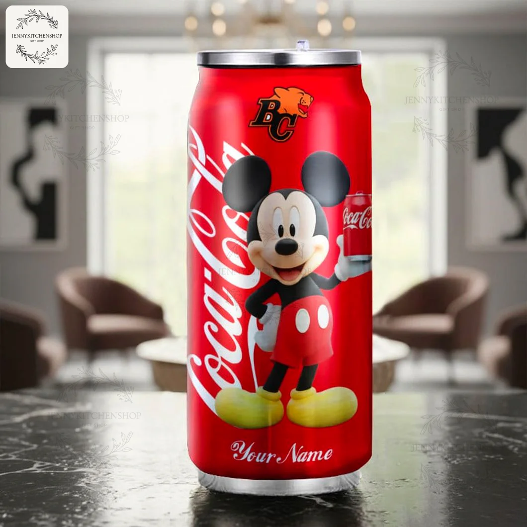 Custom BC Lions Mickey Coca-Cola Tumbler in a Home Setting The BC Lions CFL team Mickey Mouse Coca-Cola tumbler displayed on a table in a modern, stylish living room setting.