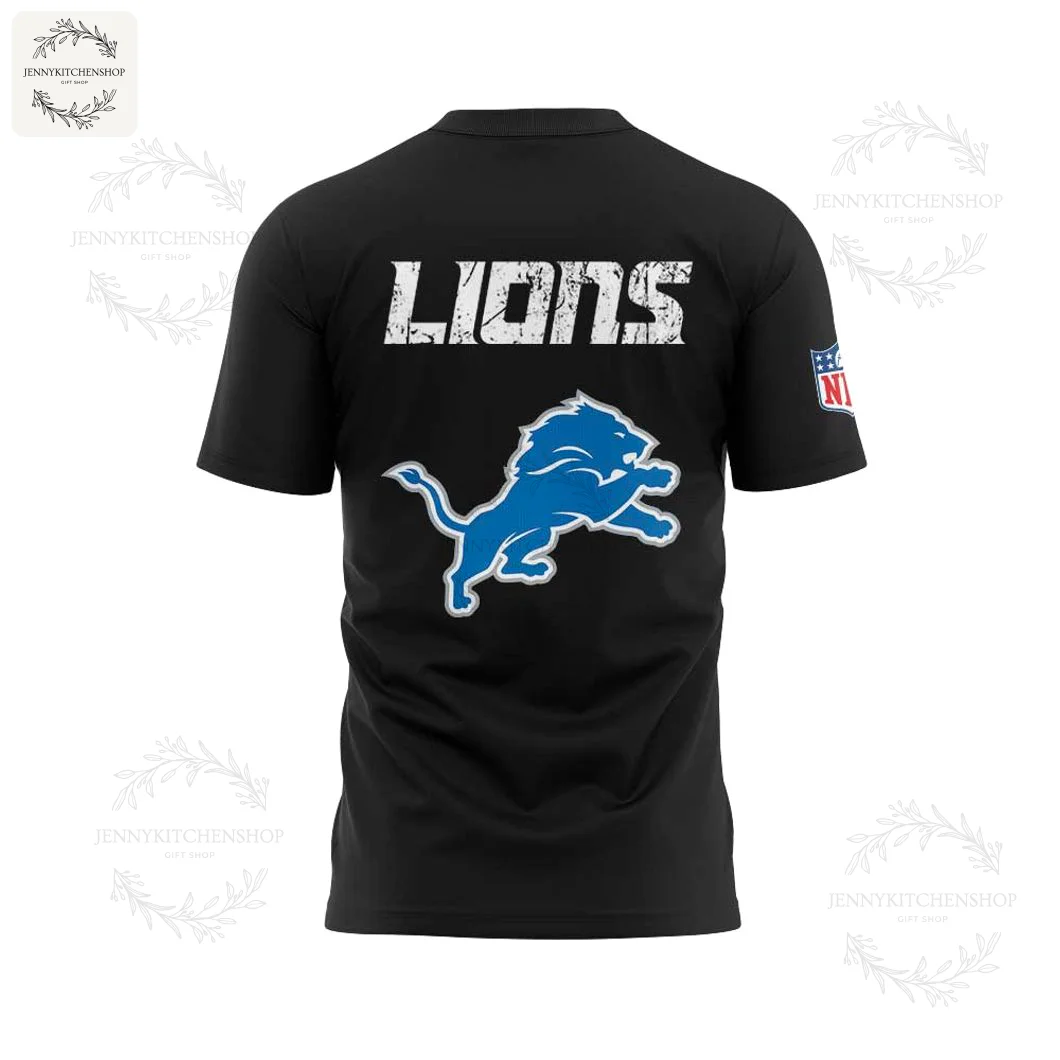 Back View of the Detroit Lions No Fly Zone T-Shirt The back of the black Detroit Lions t-shirt, showing the word LIONS in a distressed font above a large blue team logo.