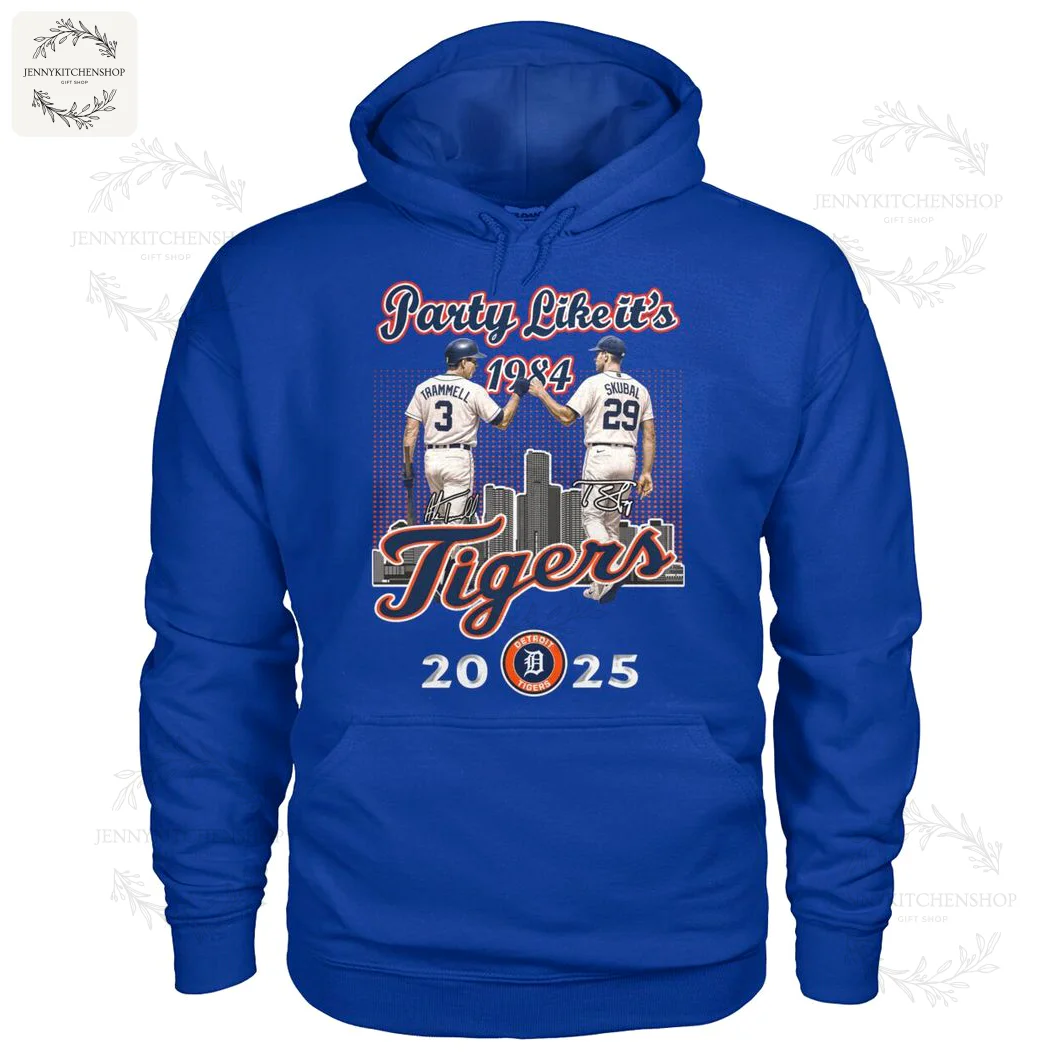 Detroit Tigers Anniversary Hoodie 1984-2025 Blue hoodie decorated with two baseball players high-fiving, featuring city skyline and anniversary years, celebrating Detroit Tigers history.