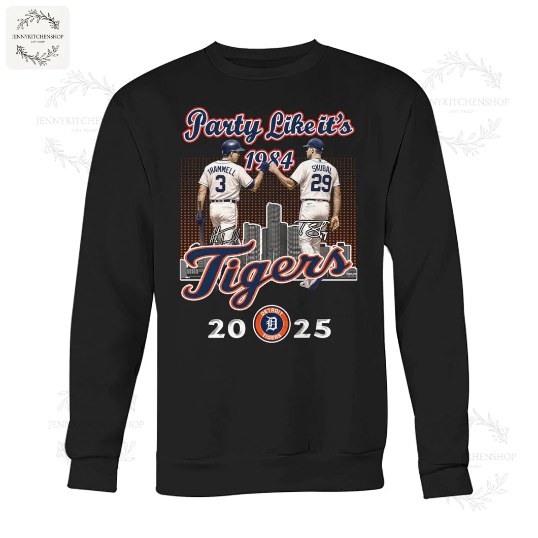 Black crewneck sweatshirt displaying two Detroit Tigers players high-fiving, with background cityscape and nostalgic text, celebrating years 1984 to 2025.