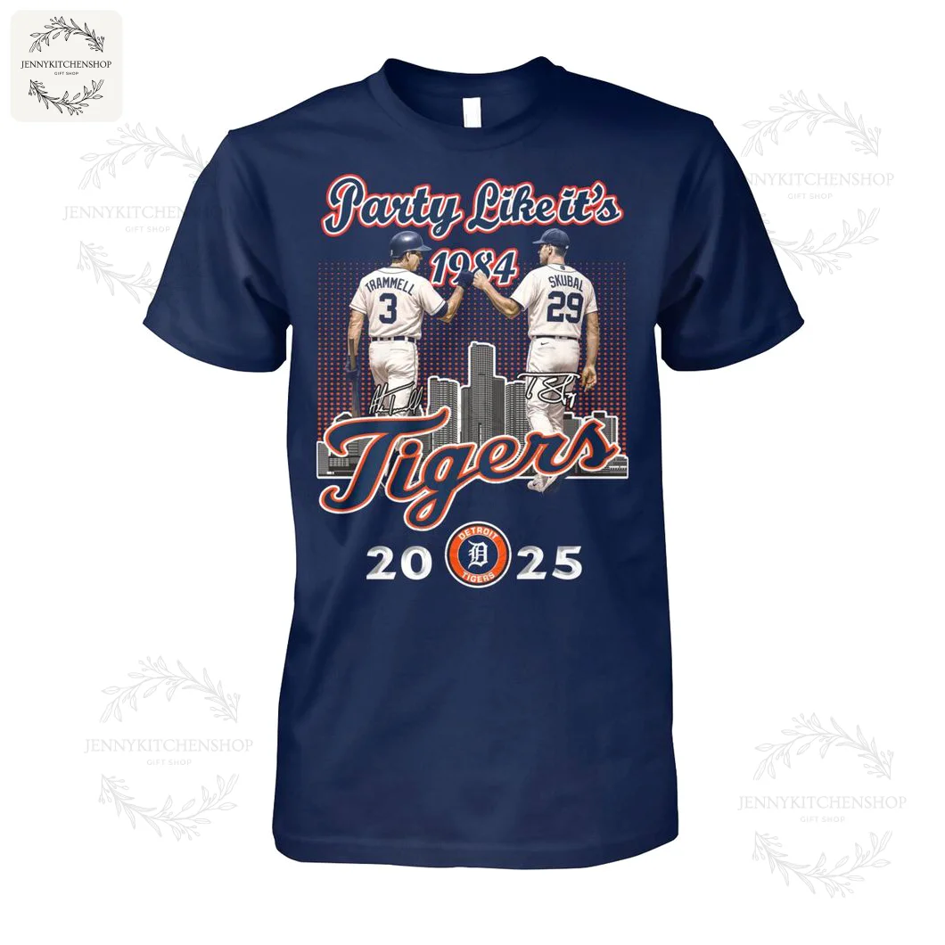 Blue T-shirt featuring two baseball players from the Detroit Tigers giving a high five, with city skyline and text celebrating 1984 to 2025.