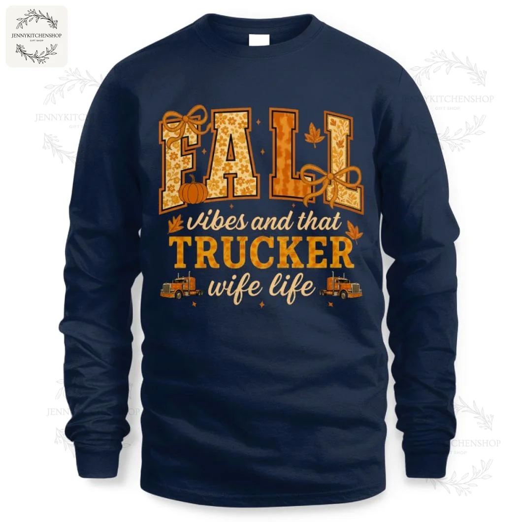 A white t-shirt for a trucker's wife with the phrase "Fall vibes and that trucker wife life" in an autumn-style font.