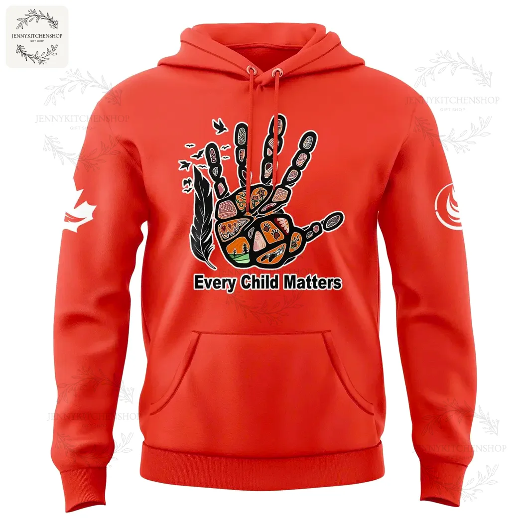 Front view of a red hoodie with a prominent "Every Child Matters" hand graphic on the chest and sleeve designs