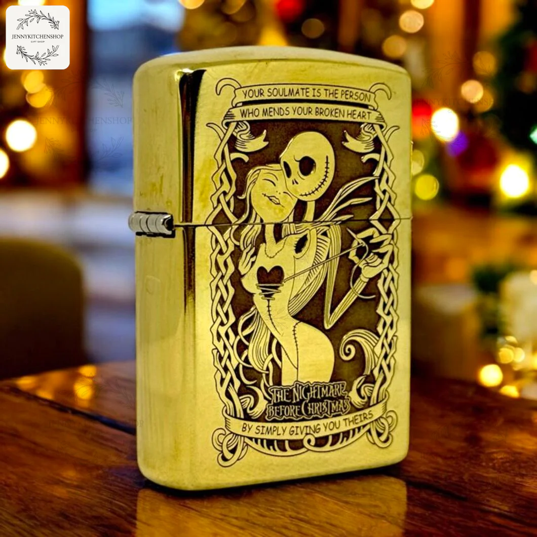 A close-up of a gold windproof lighter case engraved with Jack Skellington and Sally from The Nightmare Before Christmas.