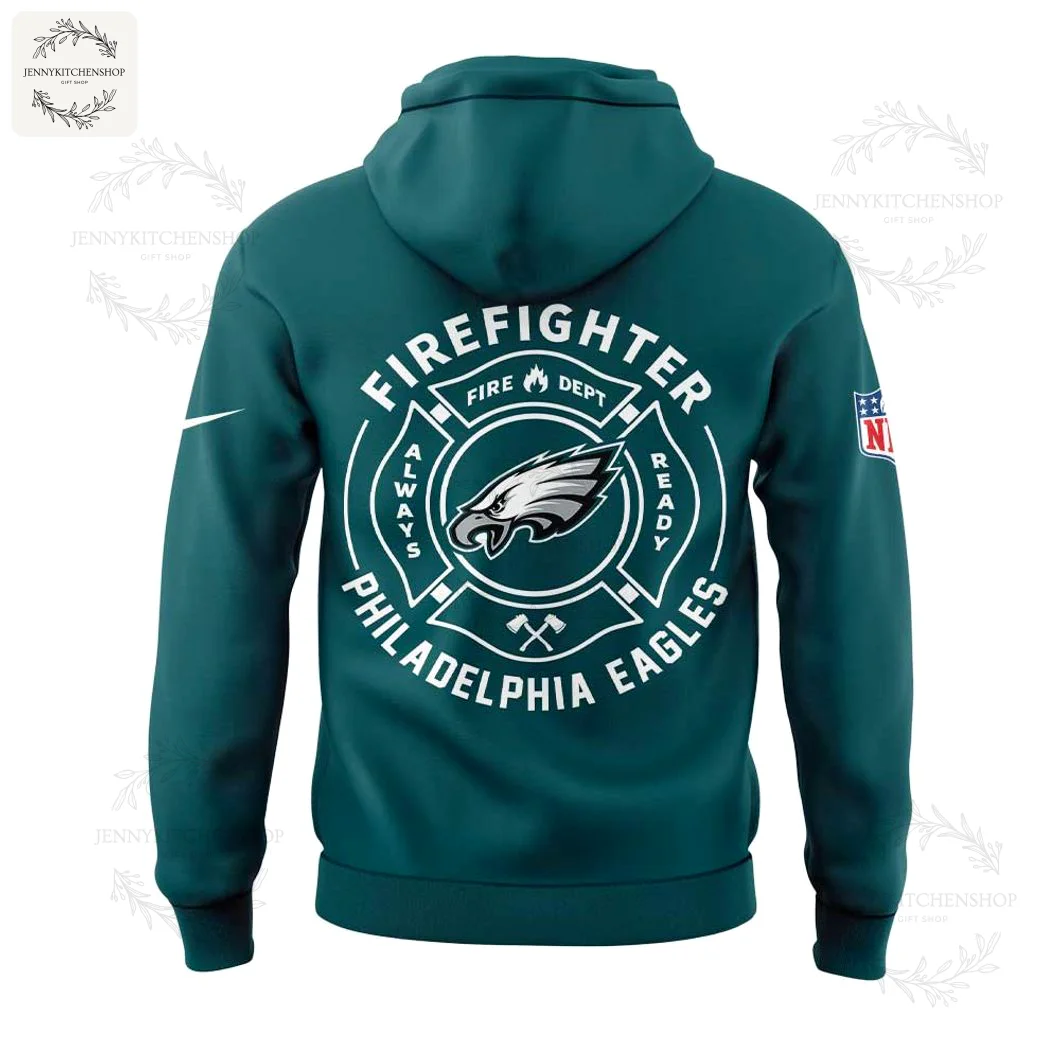 Philadelphia Eagles Firefighter Hoodie — Back View Back view of midnight green hoodie featuring a large white circular firefighter badge with the Eagles logo centered and text reading "FIREFIGHTER" and "PHILADELPHIA EAGLES," plus NFL patch on the sleeve.