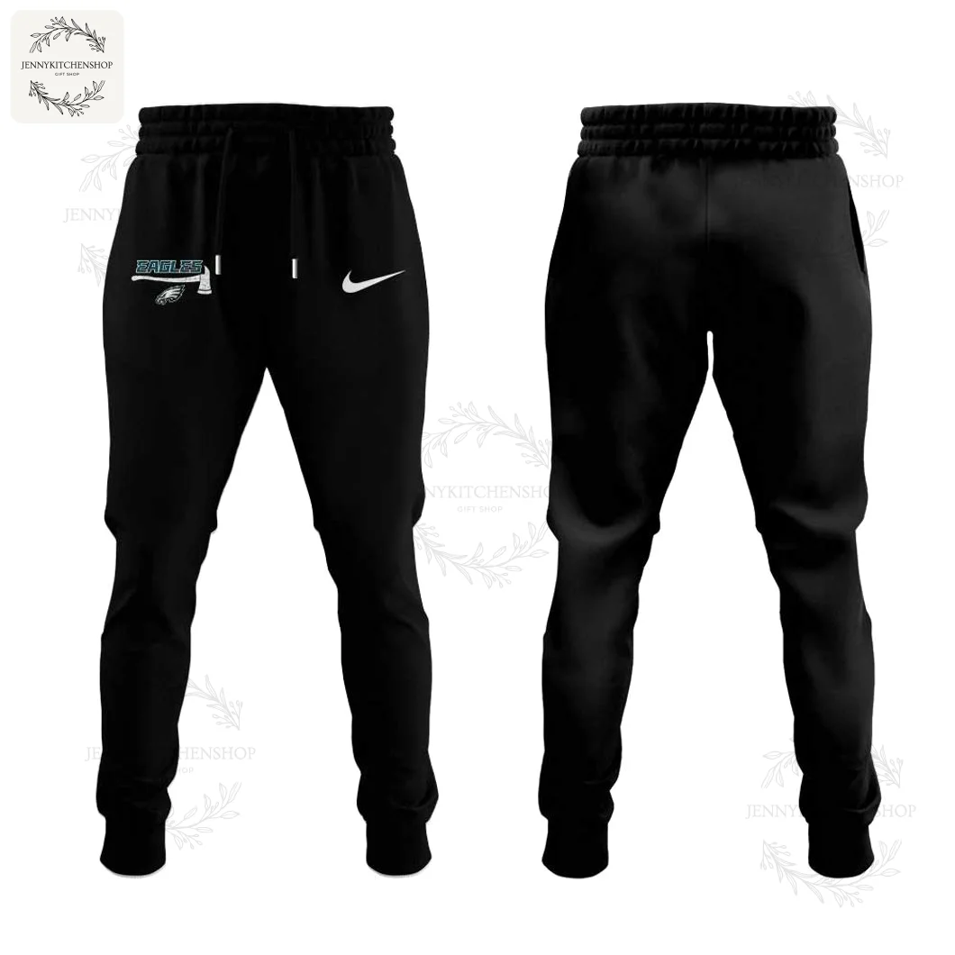 Philadelphia Eagles Firefighter Joggers — Front & Back Front and back views of black jogger pants with elastic waistband and drawstring, showing a small Eagles axe graphic and Nike swoosh on the front left hip and tapered cuffs.
