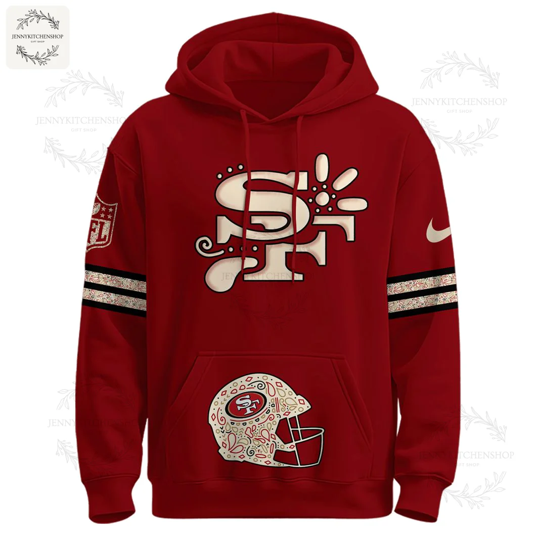 Front of the red 49ers Latino Heritage hoodie featuring a stylized SF logo on the chest and a decorated helmet on the front pocket.