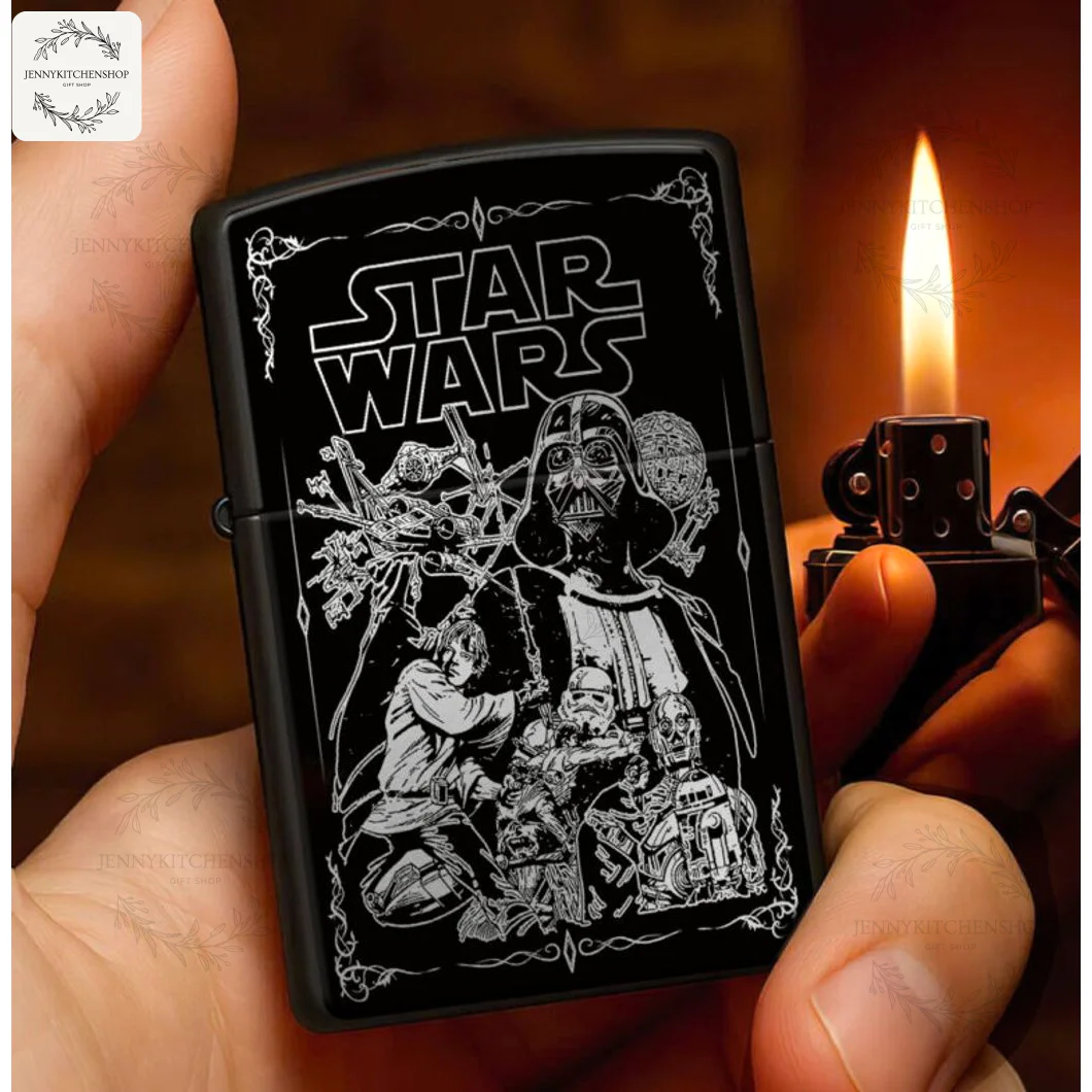 A hand holding a lit black Star Wars Galactic Saga lighter case, featuring an intricate engraving of Darth Vader and other characters.