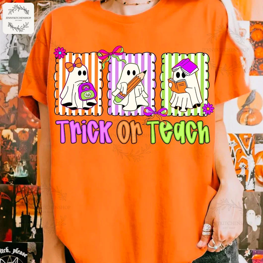 A person wearing an orange t-shirt featuring three cute teacher ghosts and the phrase "Trick Or Teach" for Halloween.