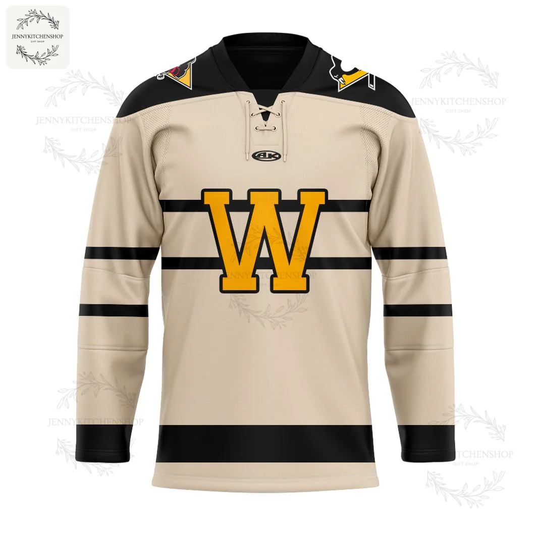 Front view of the Wheeling Nailers alternate hockey jersey. The beige jersey has black stripes and a large gold 'W' logo.
