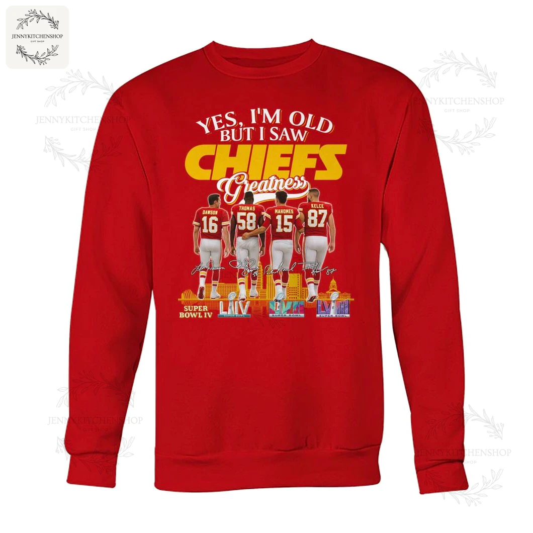 Front-facing red crewneck sweatshirt displaying the "Yes, I'm Old But I Saw CHIEFS Greatness" design with four players walking away, signature details and Super Bowl trophy icons
