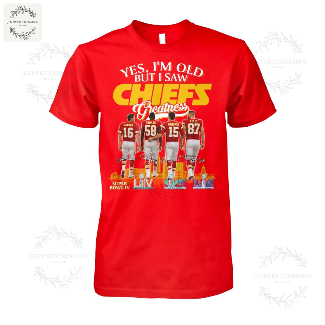 Front view of a red short-sleeve T-shirt on white background featuring bold "CHIEFS Greatness" lettering, four player backs (Dawson 16, Thomas 58, Mahomes 15, Kelce 87) and Super Bowl LIV graphics