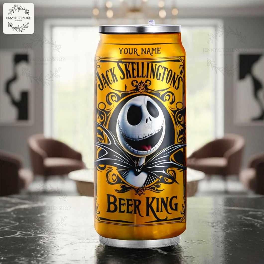 Single gold Jack Skellington can tumbler standing on a marble countertop in a softly lit living room, front label and metal lid visible to highlight design and customizable name area.