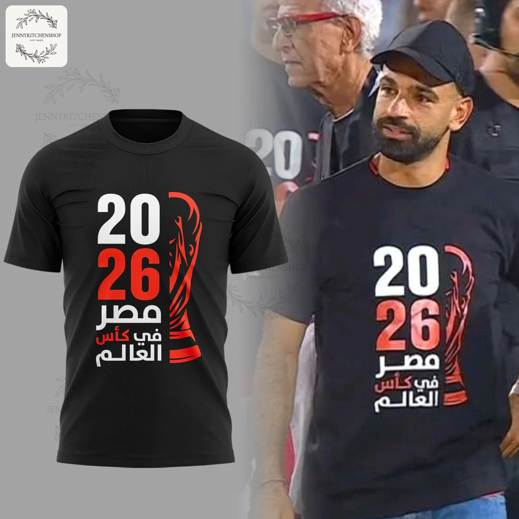 Black 3D T-shirt with front print in white and red showing '2026', a stylized trophy and Arabic slogan celebrating Egypt at the World Cup.
